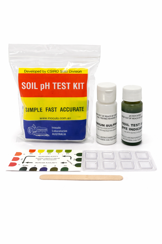 Soil pH test kit with packaging, bottles, and color chart on a white background